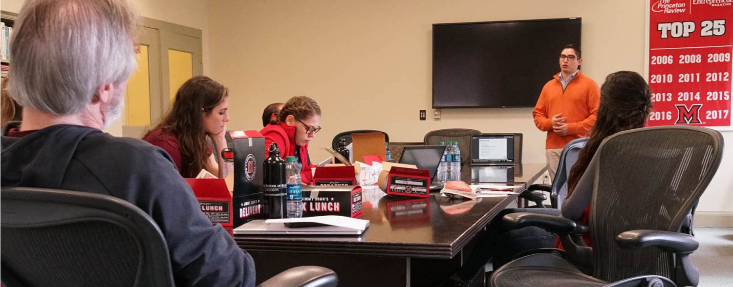 A student pitches their idea for a business at the Open Mic Lunch