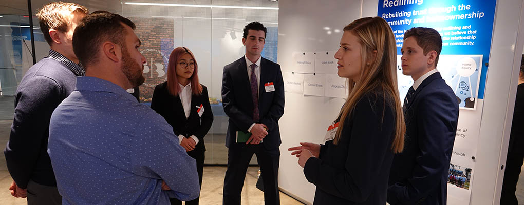 Students and Fifth Third employees at poster presentation
