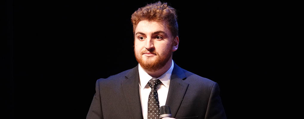 Student member of FYIC team speaks at final presentation