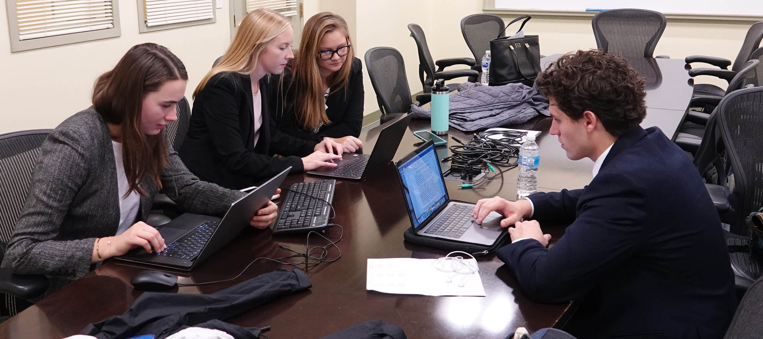A West Monroe Partners case competition team goes over their project before the final presentations