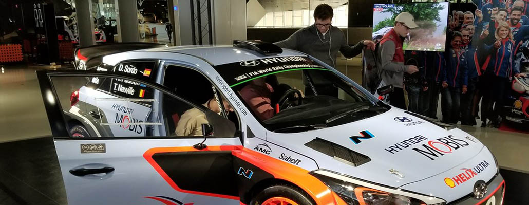 Students check out a race car at Hyundai in Korea