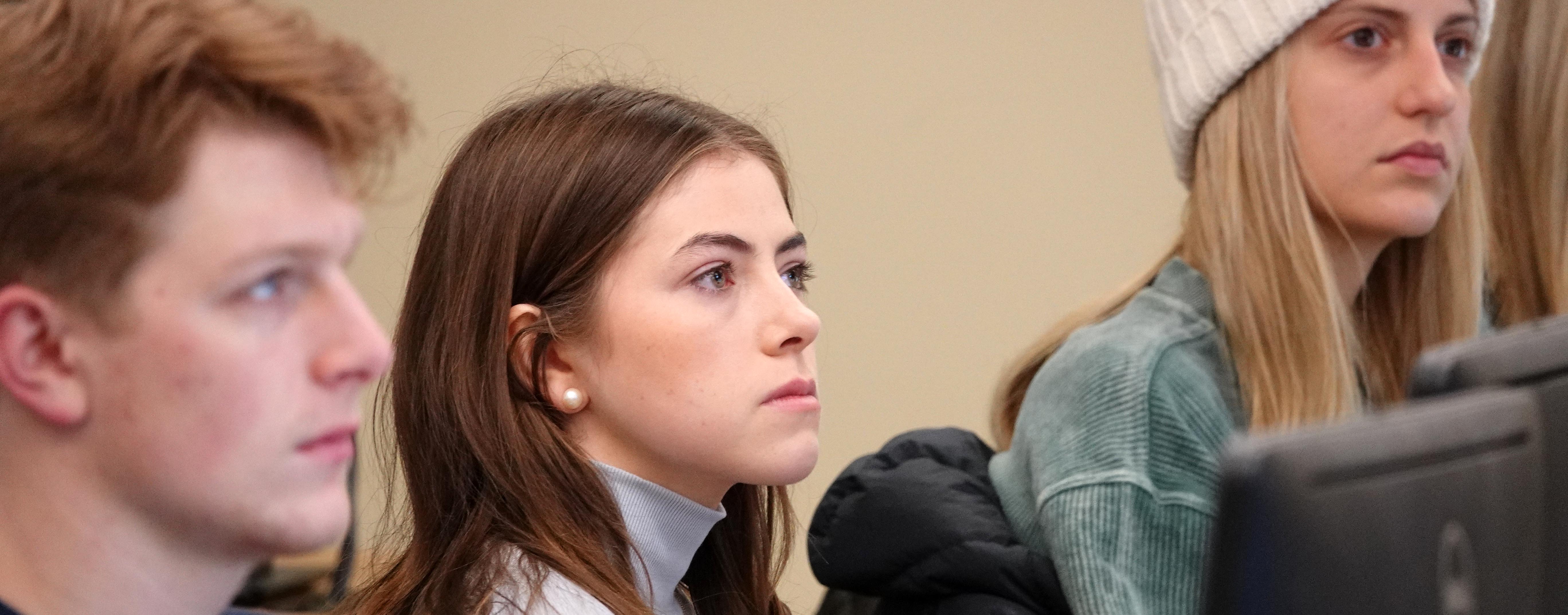 Students listen to Arthur Carvalho in blockchain class