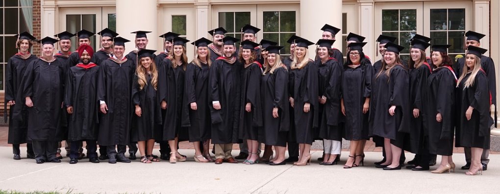 Graduating class of MBAs poses for photos