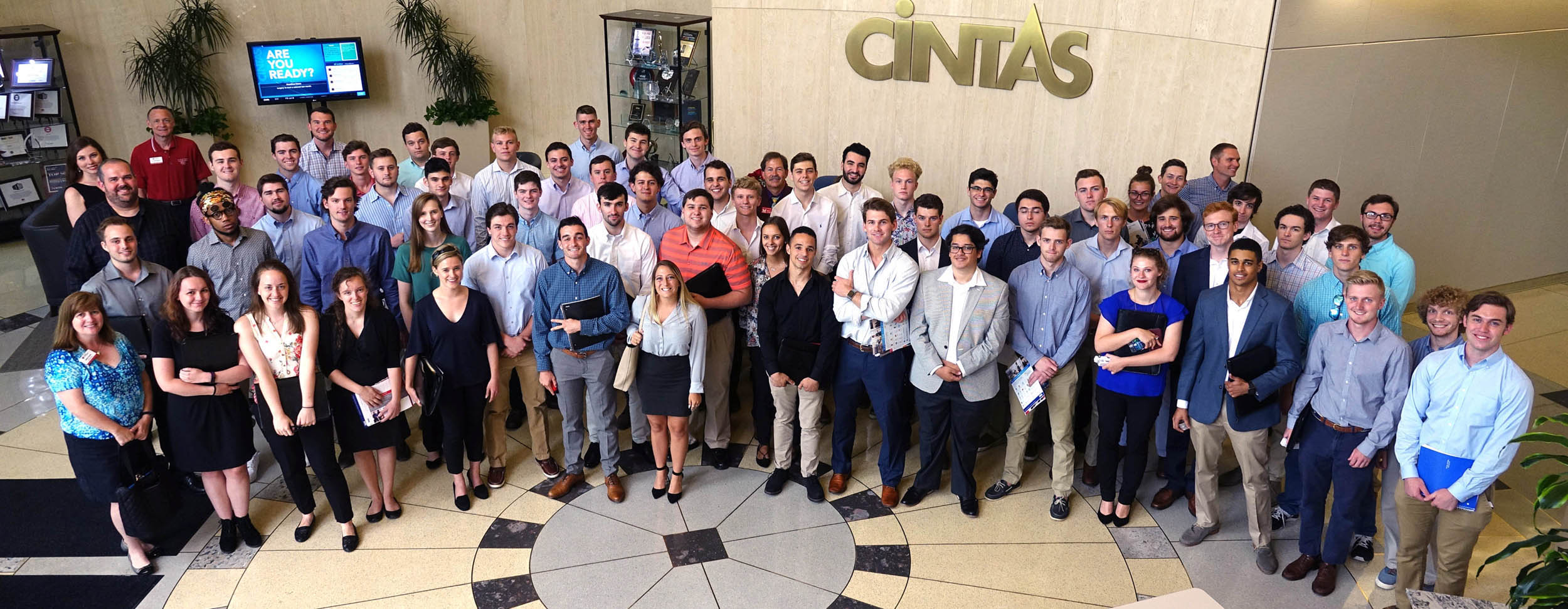 Group photo of Miami PRIME participants in Cintas' lobby