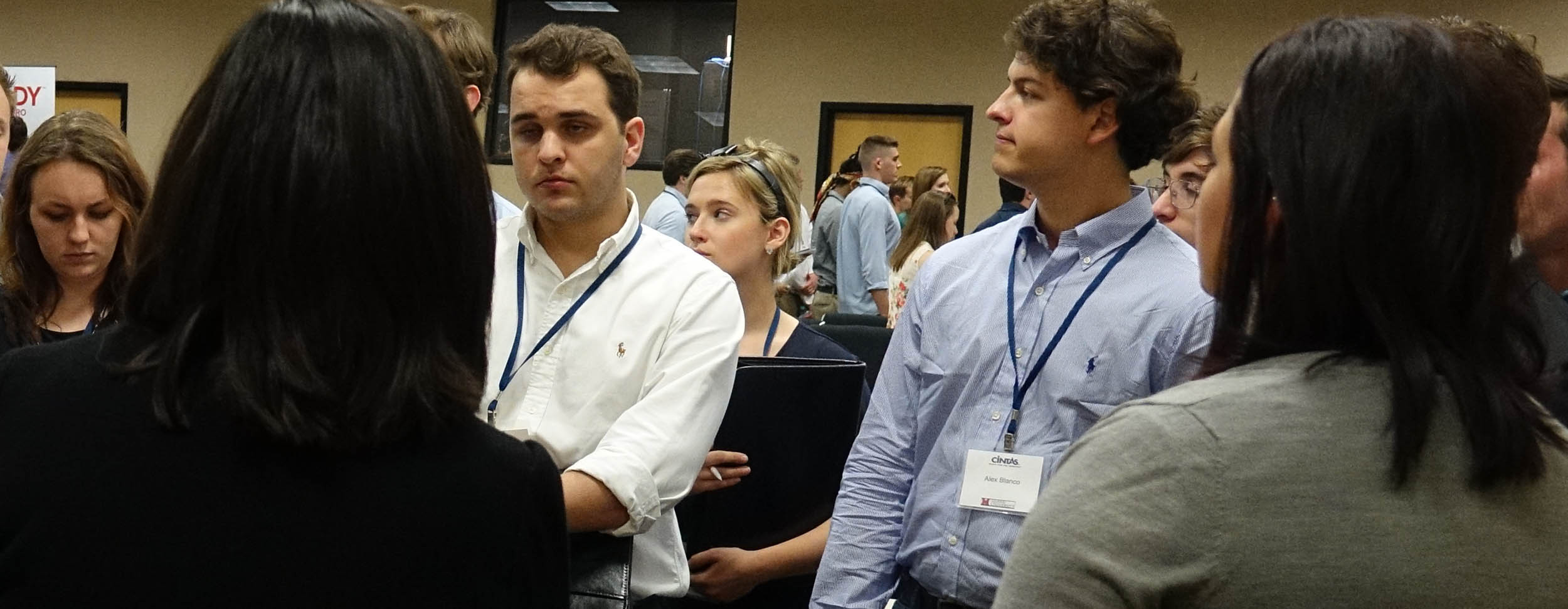 Students listen to Cintas executives talk about their businesses