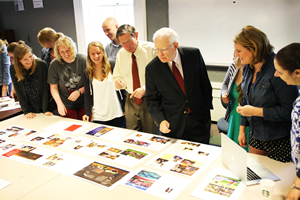 President David Hodge and Roger Howe provide students with feedback on page spreads for the Writing at Miami booklet