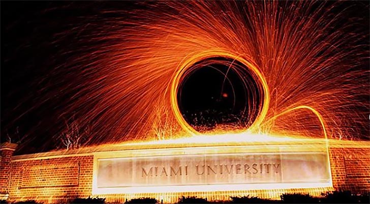 Sparks fly over a Miami University sign as part of a promotion for Creativity City