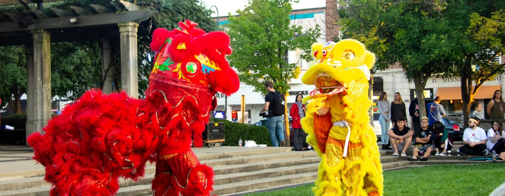 red and yellow lion performing uptown at the Chinese Festival