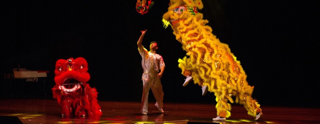 Miami students on stage performing the "lion dance"