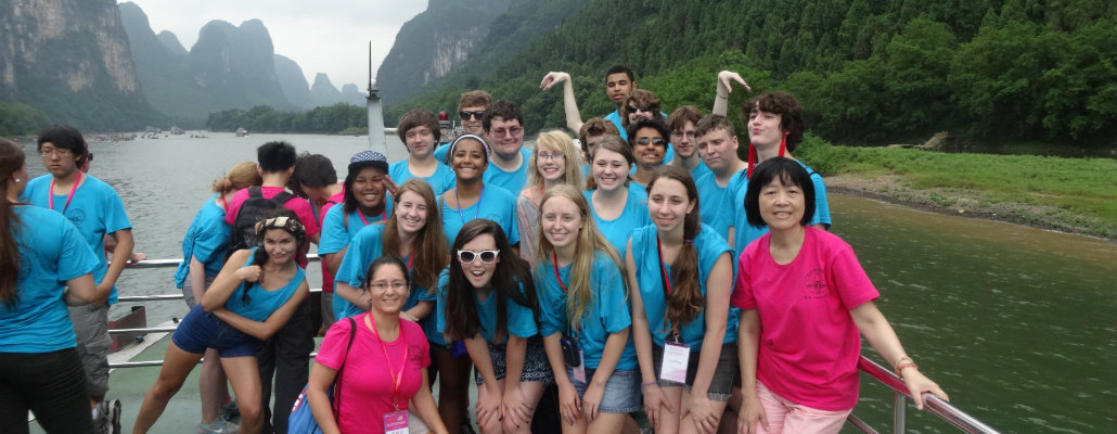 group of high school students on a ferry boat in China with instructor