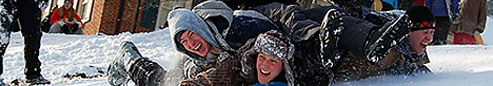 Students sledding to enjoy the snow