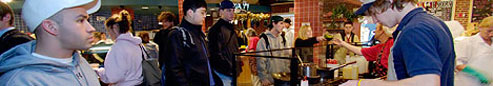 Students watching their food being prepared