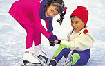 Two children skating