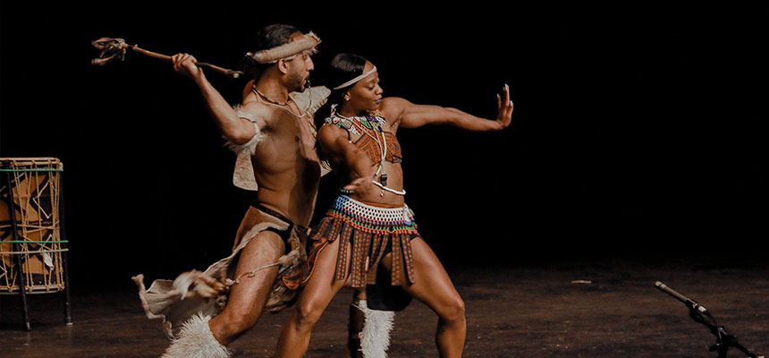 The dance group step Africa on the stage of Dave Finkelman Auditorium.