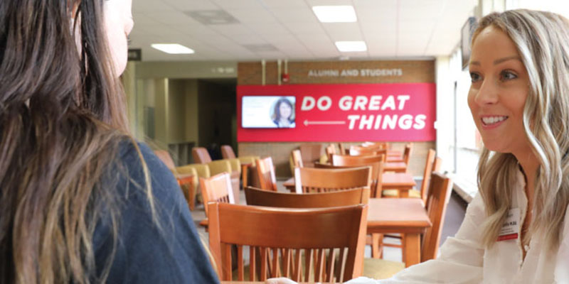 Admission counselor talking with a prospective student