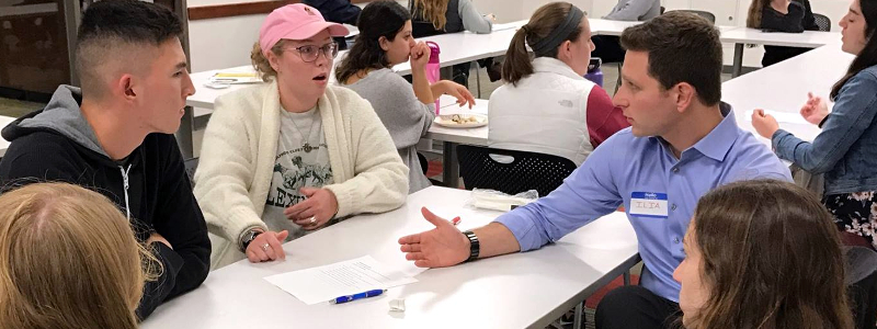 Students engaged in conversation during a Thinking Outside the Box event