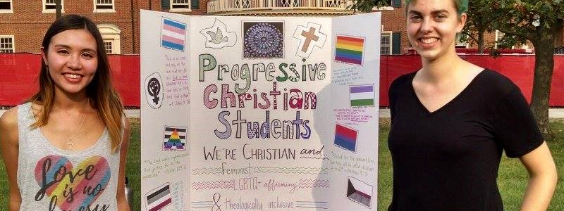 Members of the group Progressive Christian Students pose with a display at Mega Fair