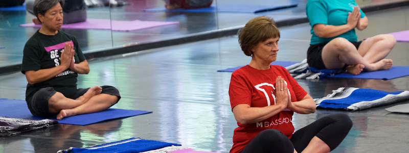 Women seated on yoga mats