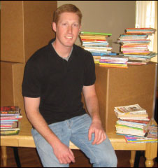 Craig Beaker ’08 with 28 boxes of books.