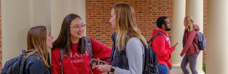 Students chatting outside the Armstrong Student Center