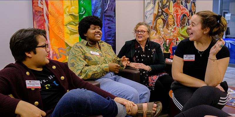 Group of students and staff gathered in Women's Center