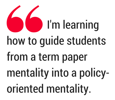 Emphasized quotation. Text: I'm learning how to guide students from a term paper mentality into a policy-oriented mentality.