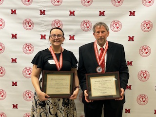 Elizabeth and Bill with their award plaques
