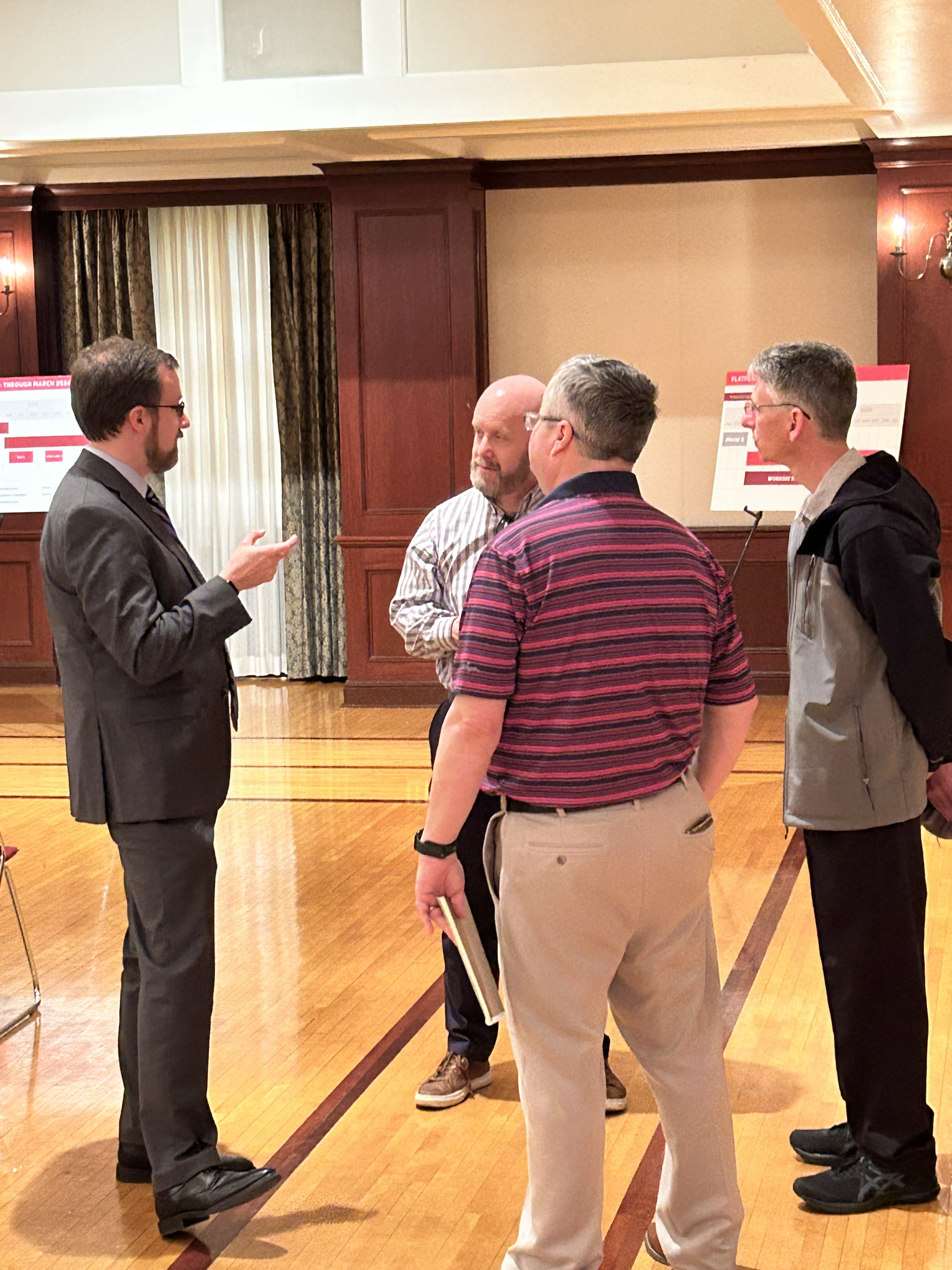 David Seidl talking to other attendees at the Workday Kickoff event