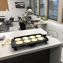 Leah Harris making pancakes