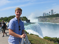 Jeron Heil standing next to a fountain