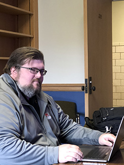 Jake Harrison sitting at his computer