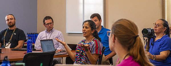 People speaking together at a workshop