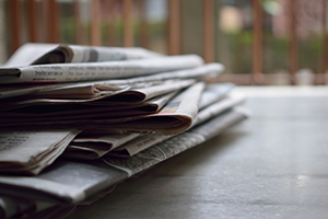 Pile of newspapers seen from the side