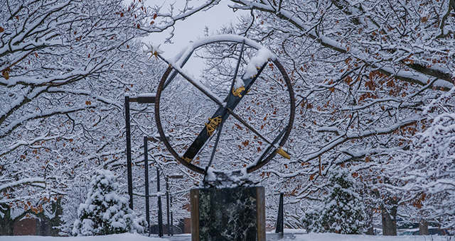The Miami compass sculpture in a winter scene
