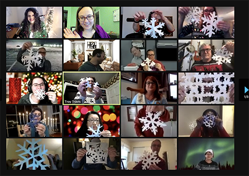 A grid of Zoom calls with everyone showing their snowflakes they made during the crafting portion of Camp Winterfest