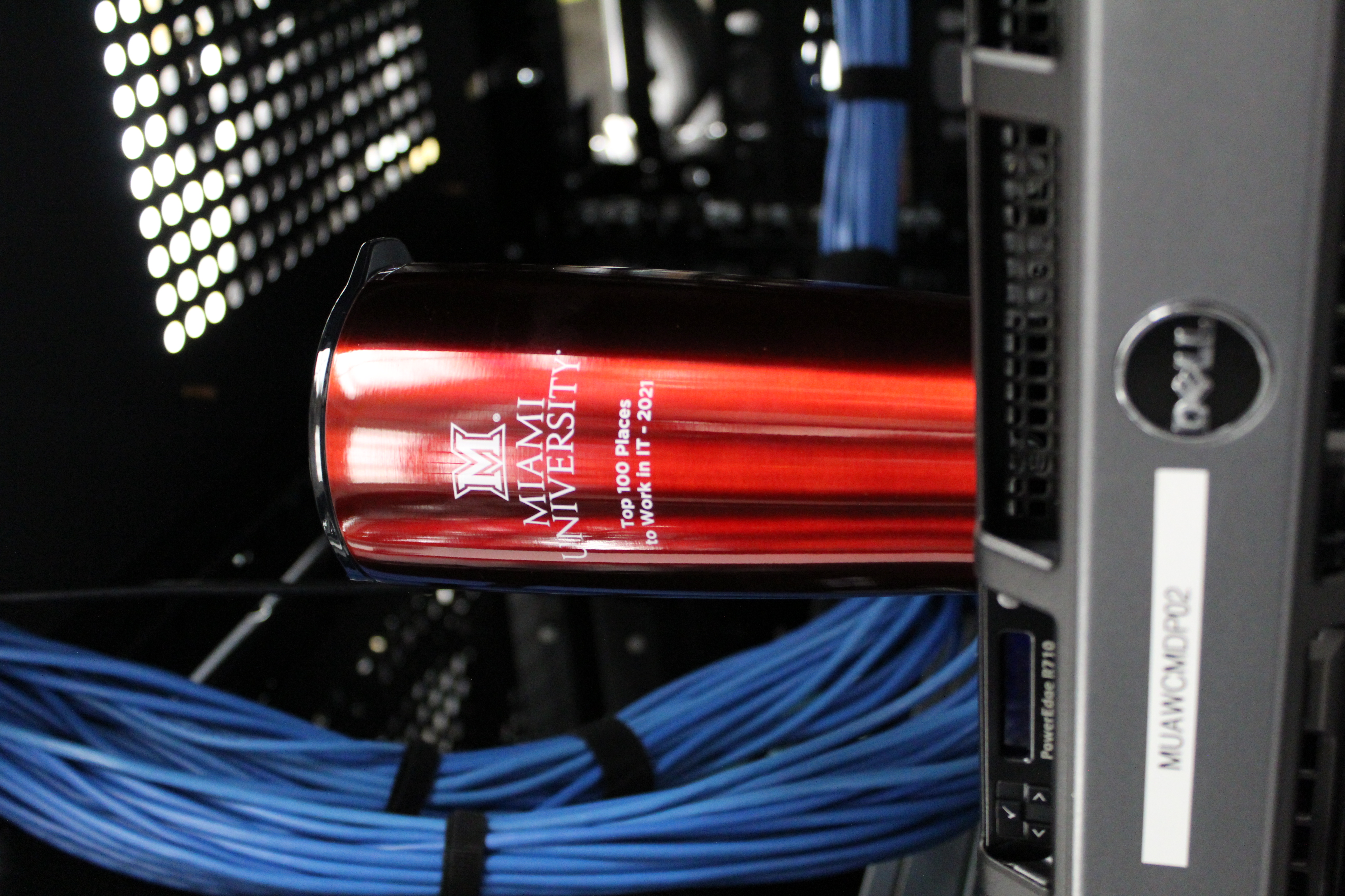 A red beverage tumbler sitting in a server in the Data Center