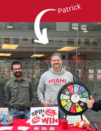 Patrick Hawk on the right behind a table for security awareness month