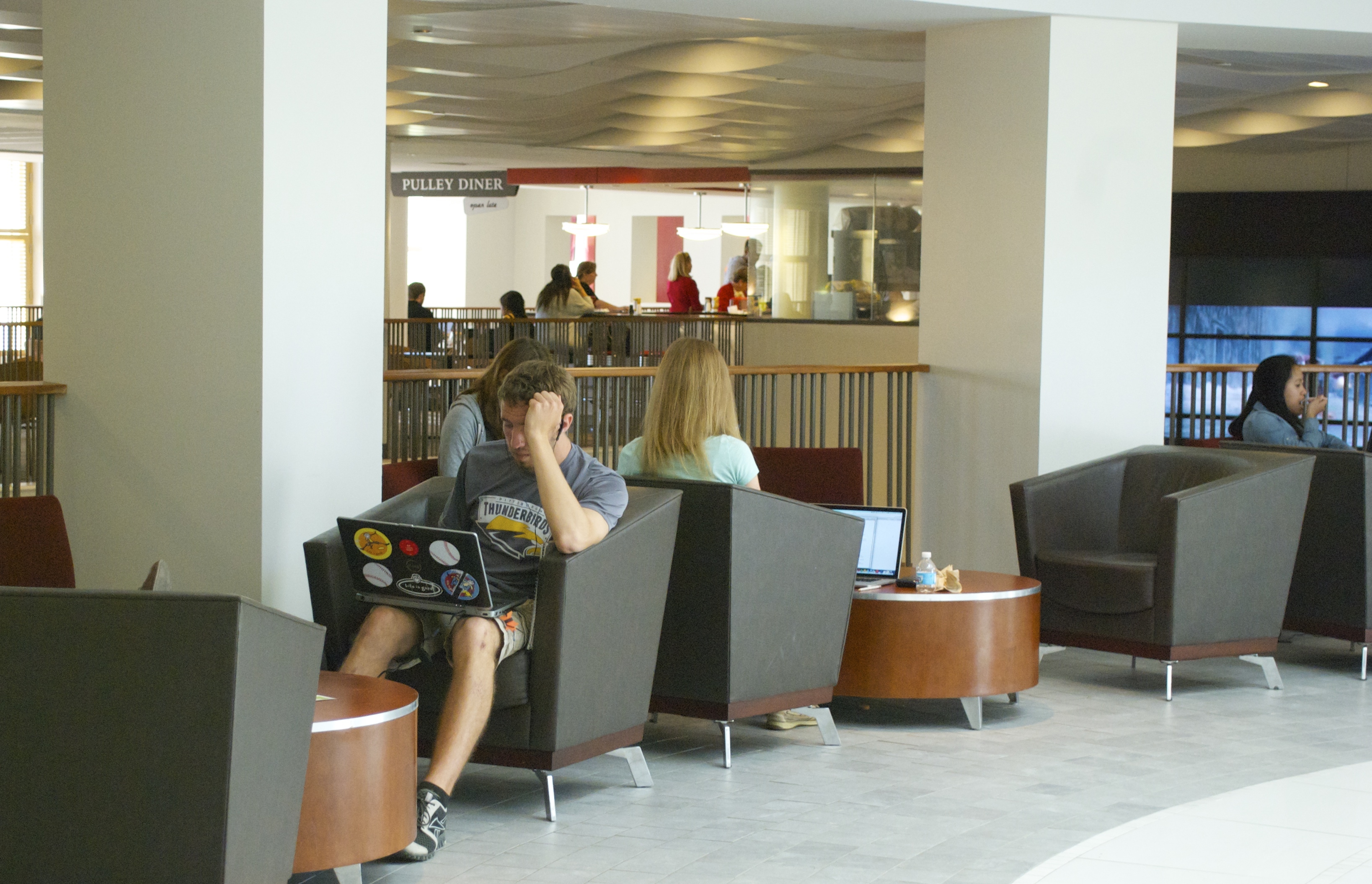 Students sitting in armstrong using their computers