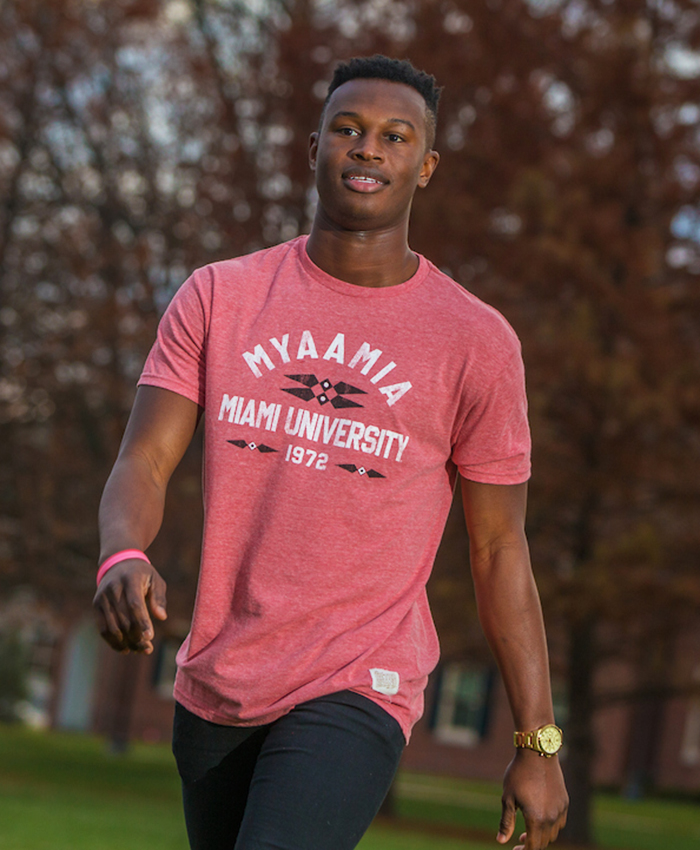 Heather red t-shirt. Design includes the ribbonwork mark. The word 'myaamia' arches over the words 'Miami University 1972'