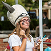 A female student wears a big, fury, white viking hat