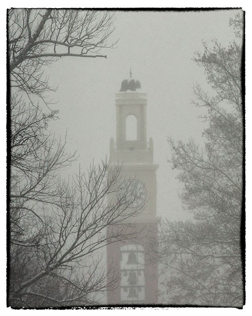 Snow falls on Bell Tower.