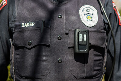 Camera is worn on the uniform near the badge.