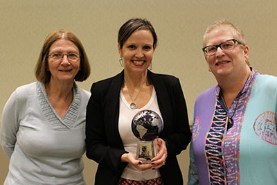 Nohella Rojas-Miesse receives award from Provost Phyllis Callahan and Cheryl Young