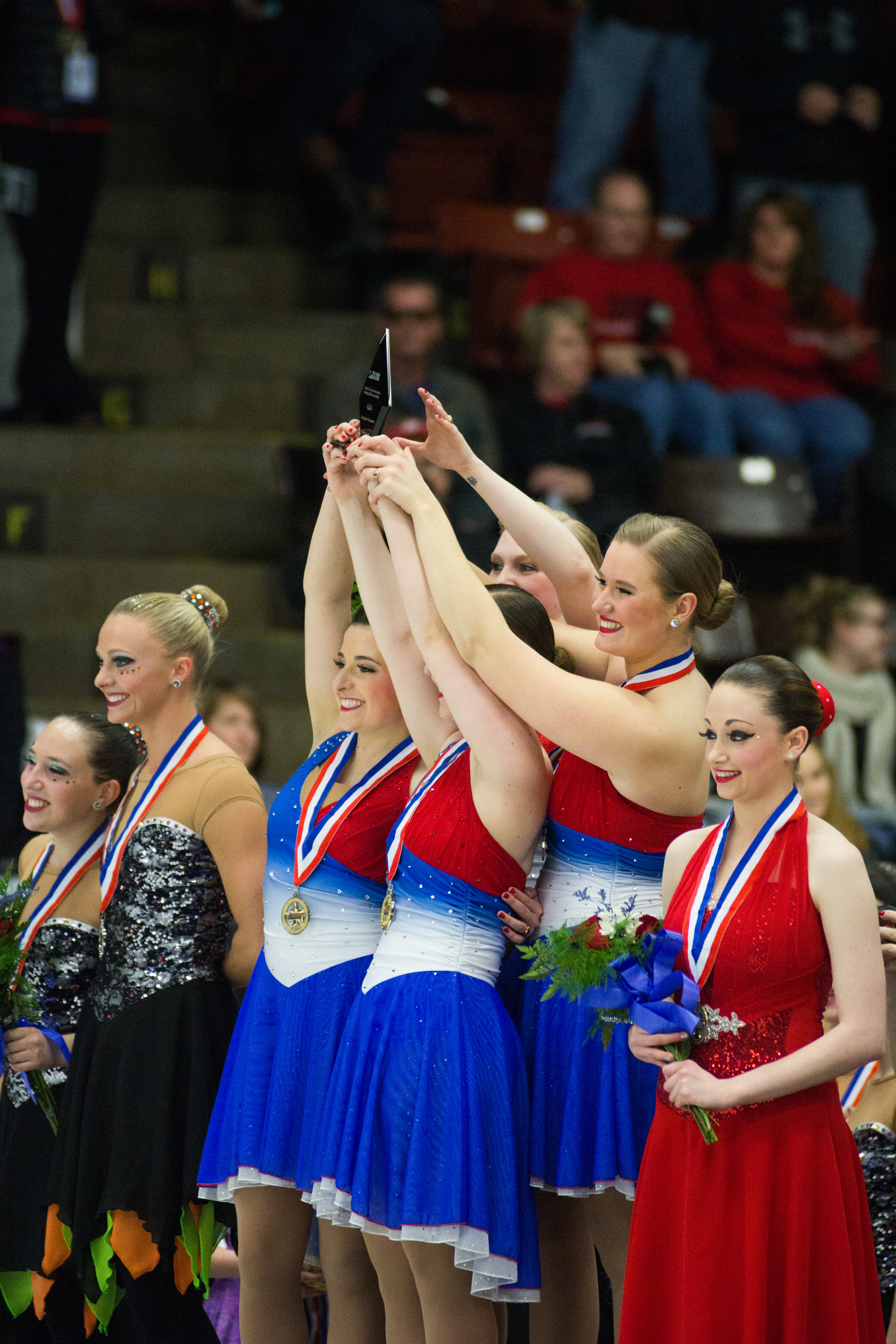 Skaters celebrate their win on the podium