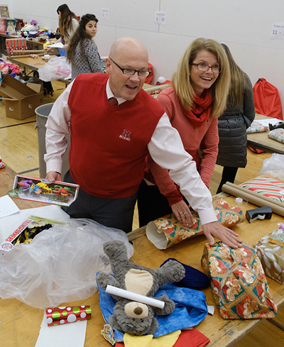 Crawfords help wrap presents.