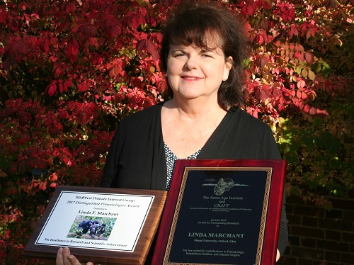 Linda Marchant with award plagues.