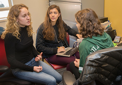 Students discuss the business of the day.