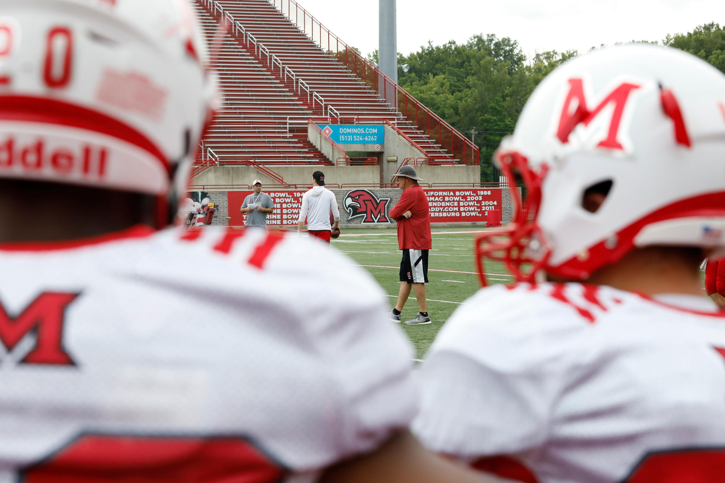 Chuck Martin coaches the RedHawks during practice.