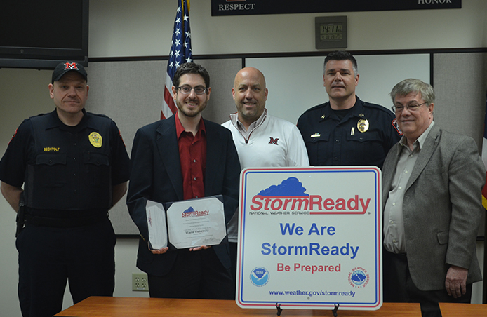Five men standing together as Miami receives StormReady certification