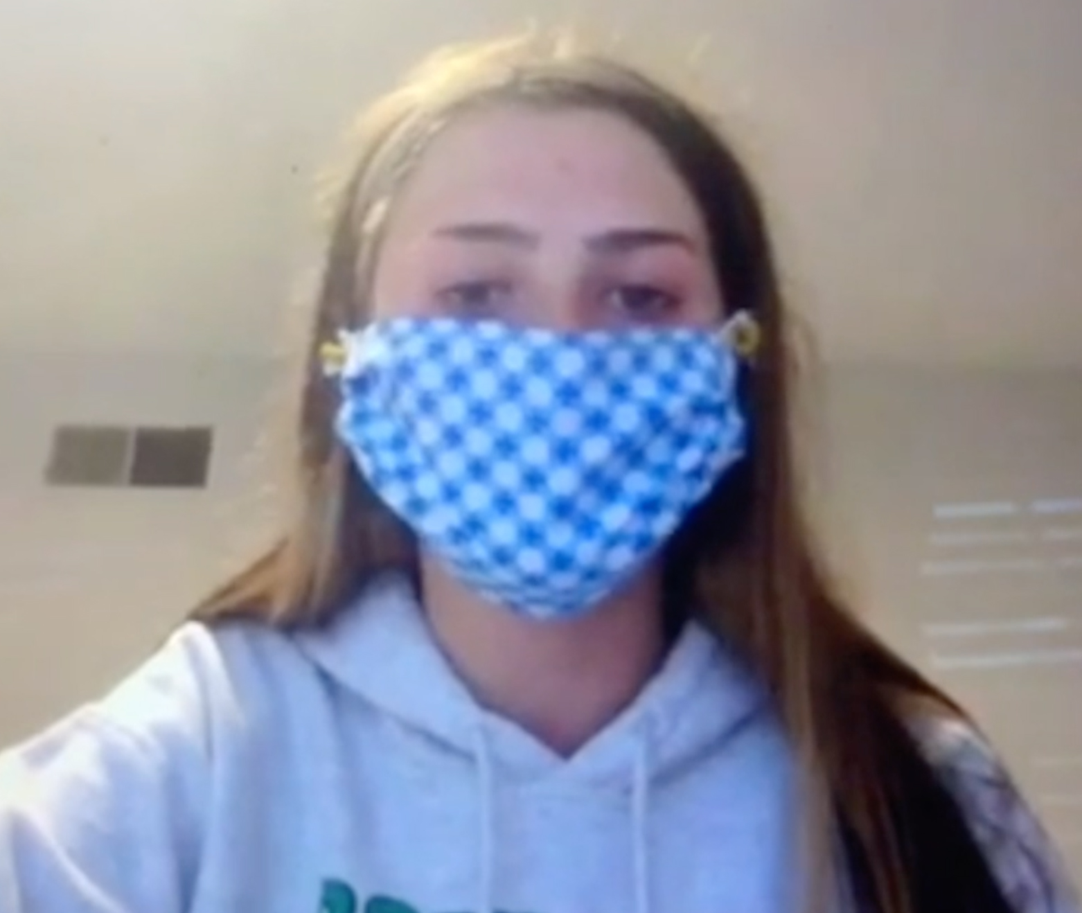 Maggie Rush wearing a cloth face mask